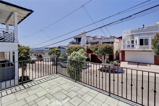 expansive patio in front of home with views of neighborhood.
