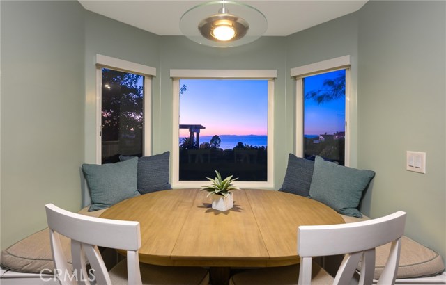 View of sunset through bay window built-in nook