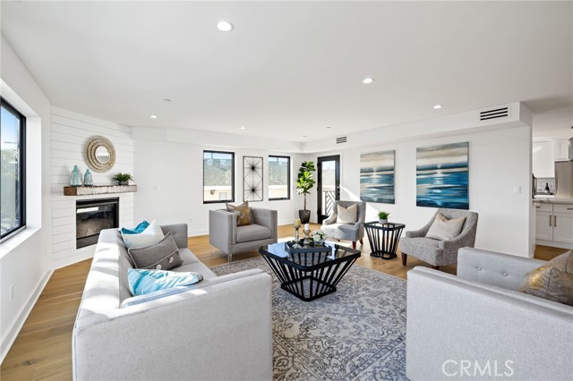 Main floor living area with statement corner fireplace