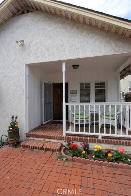 Sweet front porch. Back to a more simpler time.