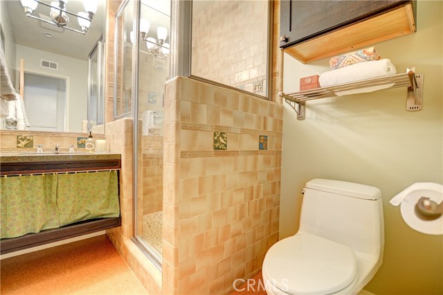 Bathroom has granite counters and tile shower. Bathroom has granite counters and tile shower.