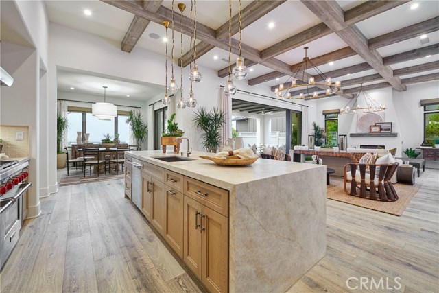 Kitchen opens to great room, dining room with a view. Model home shown.