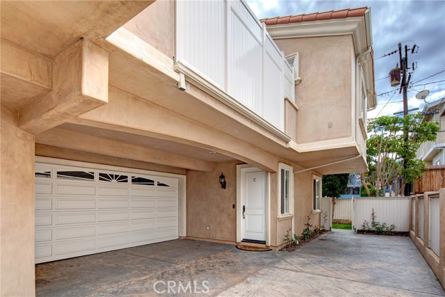 Private and quiet rear unit with stamped concrete driveway and guest parking.