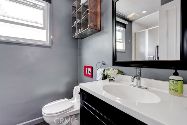 This three quarter bath (with shower) is on the main level adjacent to the bedroom.