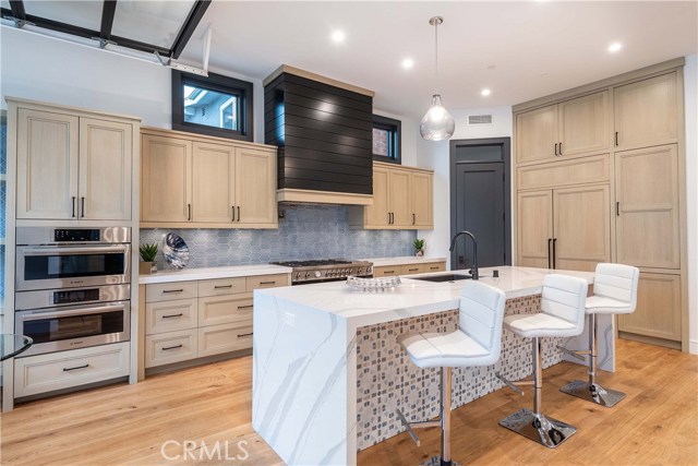 The Kitchen Island measures 10.5' x 3.5' is full granite with Waterfall sides. Note the outlets are on the side providing a clean look for the island surface.