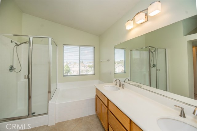 Nice vanity fixture, Garden tub and enclosed glass shower