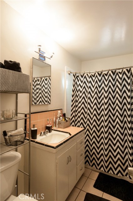 Full bath in unit #2. Tile floors and upgraded tub/shower tile.