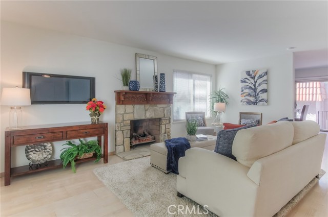 Living room with glimpse of patio on right side