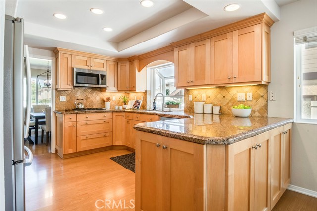 The cook's kitchen features maple, Shaker style cabinets with drawers and pull outs, for ease of storage and granite counter tops.