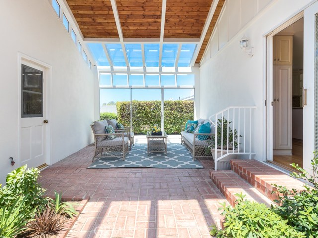 enclosed courtyard in front entrance near kitchen