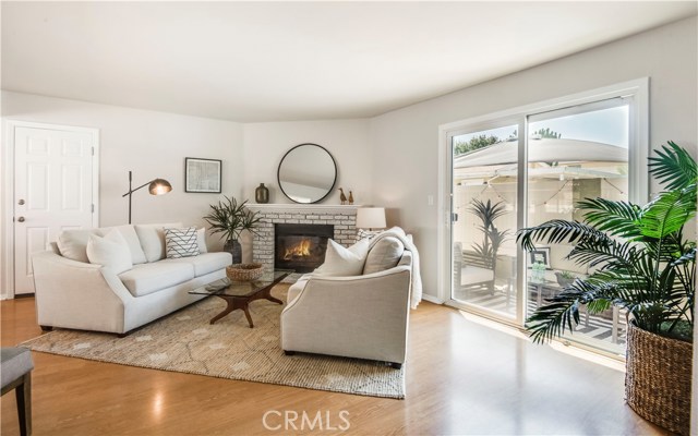 You'll love to gather friends and family in this family room adjacent to the kitchen and outdoor patio.