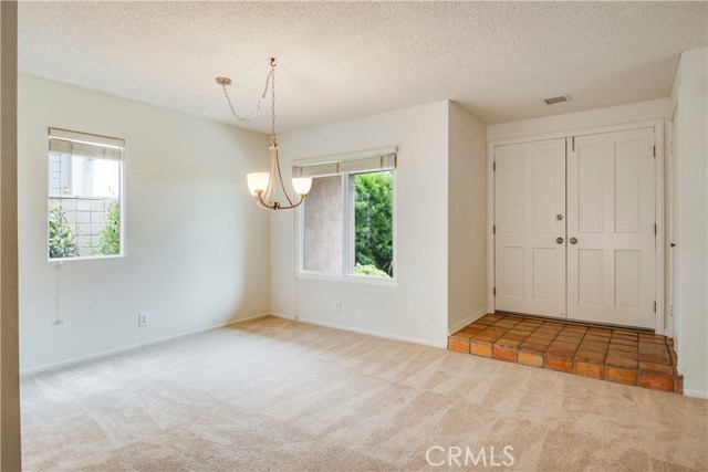 Double door entry and dining area.