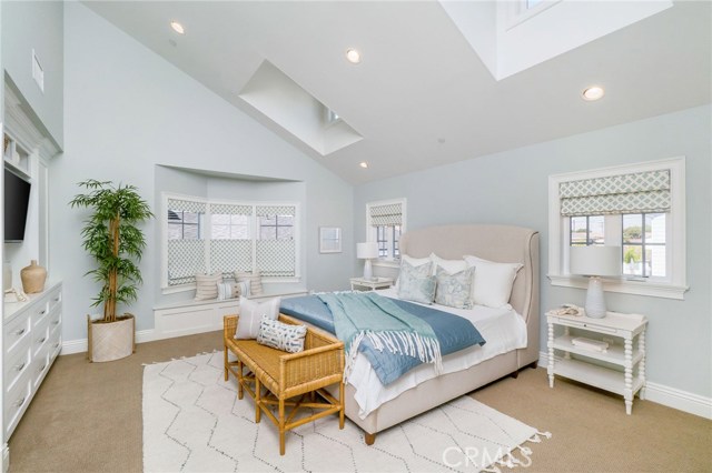 This Master Bedroom calls for rejuvenation with the vaulted ceilings, skylights, custom window treatments and built-in window bench (with storage) for lounging with a great book... spend the morning in retreat.