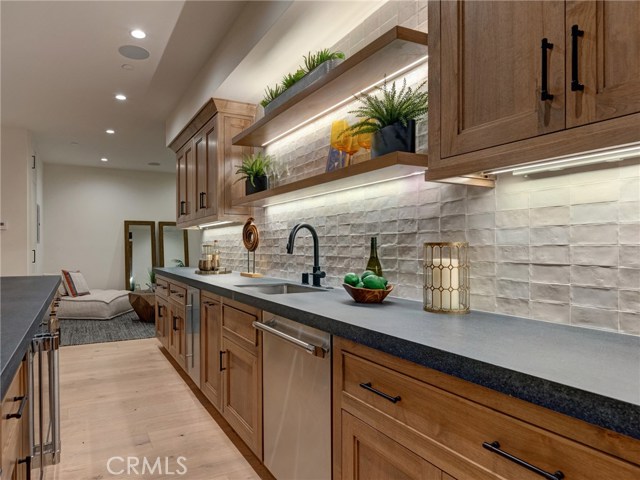 HUGE 1,557 sq. ft. entertainer's dream basement with full bar, dishwasher, ice maker, fridge, 86" TV already installed, surround sound, wired for Dolby Atmos 9.4.2 channel cinema, lounge area, half bath, downstairs bedroom suite.