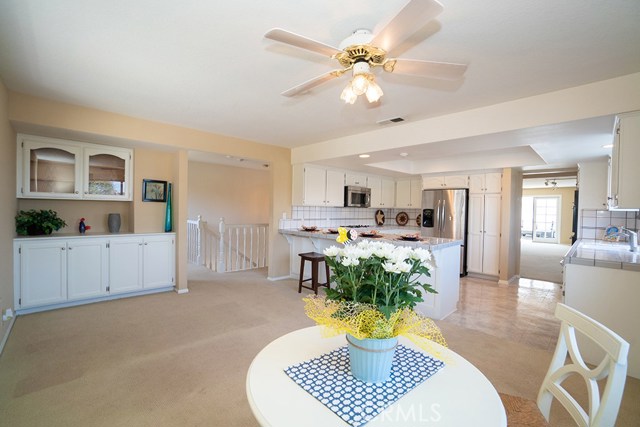 Family room looking into the kitchen and out into the deck-patio