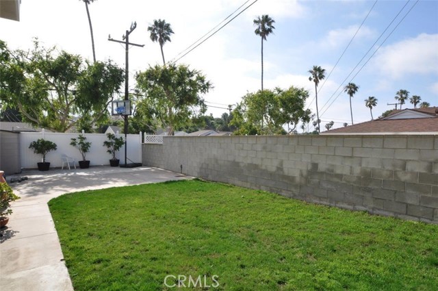 A great backyard with lawn and cemented area