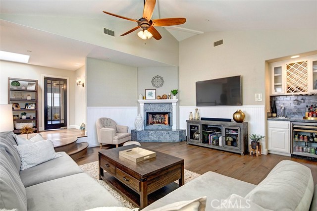 swinging glass door separates family room from bedroom hall area