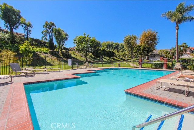 Beautiful community pool and spa with charming picnic area.