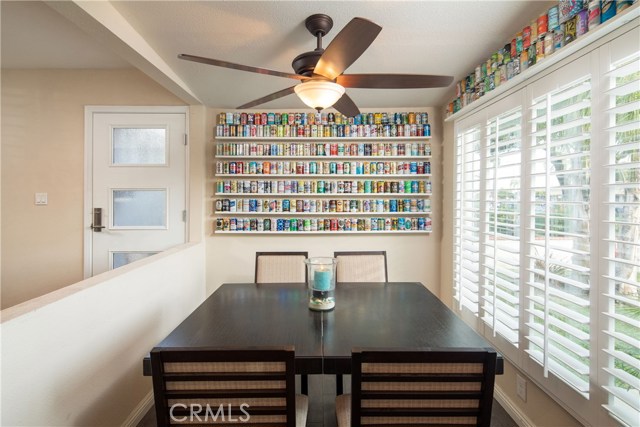 The dining area is an intimate setting overlooking the lush landscaping and front yard.