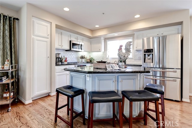 Gourmet chef's kitchen includes updated cabinets, crown molding and Beveled Subway Tile backsplash.