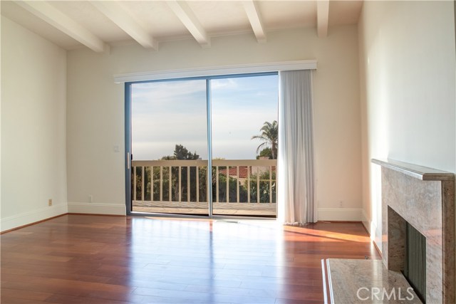 Master Bedroom with fireplace and an ocean view. Walk around balcony on top level.