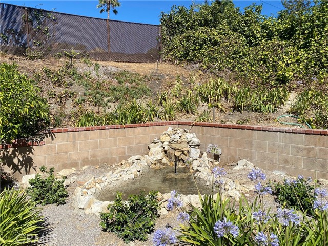 Hear the sounds of hypnotic water falling from the backyard pond