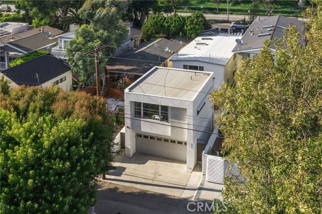 Rear view of property from alley (guest house and garage) then main house.