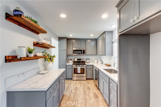 stainless steel appliances and fully remodeled kitchen