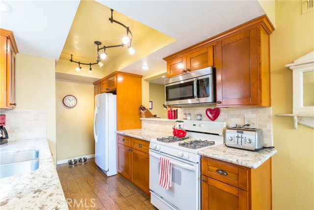 Shaker style cabinets, bronze handles, & granite counters Shaker style cabinets, bronze handles, & granite counters