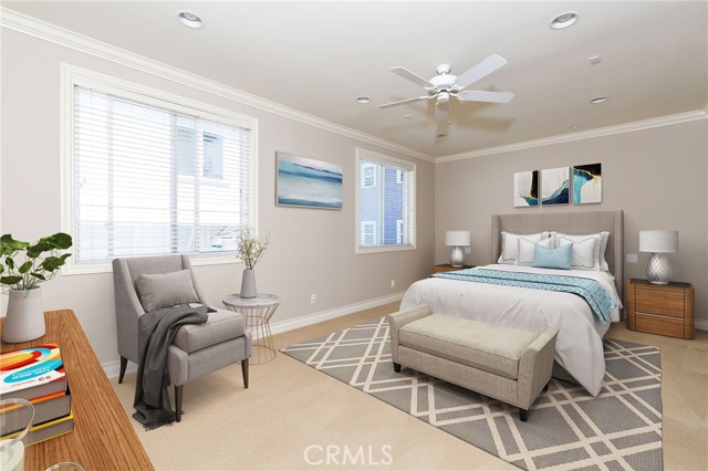 Oversized primary bedroom with recessed lighting, ceiling fan, and two large windows - home is virtually staged