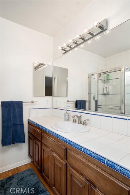 Master bathroom has nicely tiled counters and shower stall.