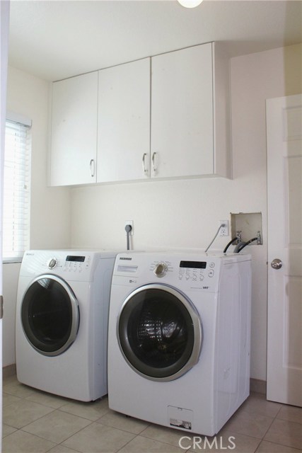 laundry room conveniently located next to kitchen