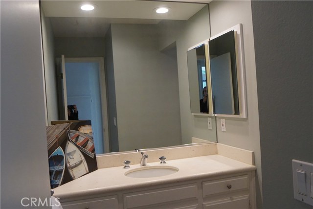 Third bathroom is across hall from bedrooms. Limestone counters and slate floors.