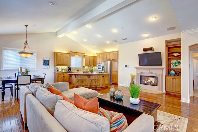 Huge open floor plan, tons of natural light, beautiful engineered hardwood floors, cooks kitchen with a giant island, and the first of two fireplaces.