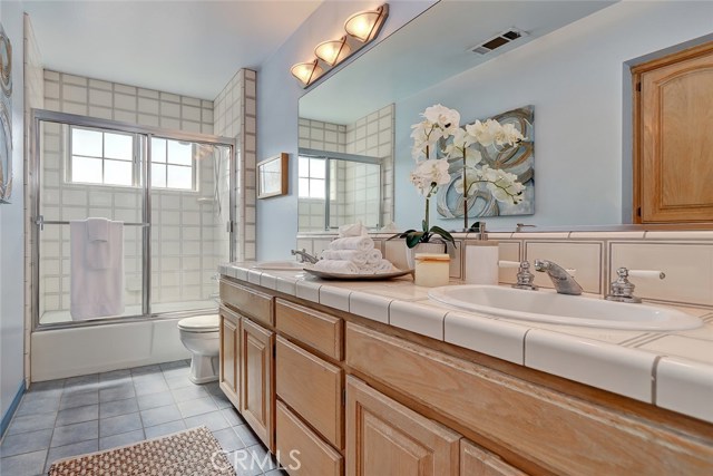 Second Floor Hallway Full Bathroom with Dual Sink Countertop