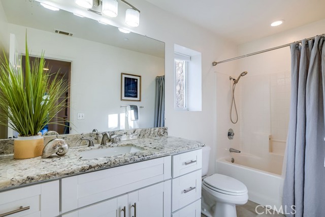 Full bathroom upstairs with beautiful countertops and brushed nickel finishes
