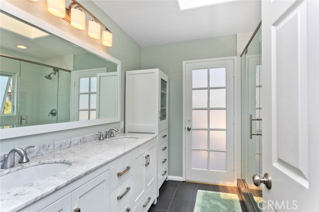 En-suite master bathroom with marble counters, double sinks, new vanity, walk in shower and more!