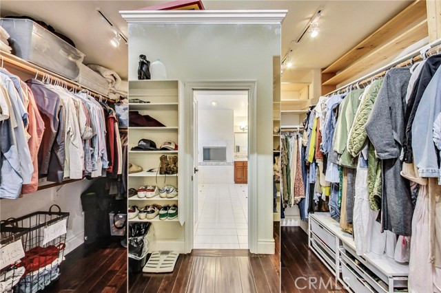 Large walk-in closet and center shelving/drawers. Mirror makes this picture look small but the closet is quite large.