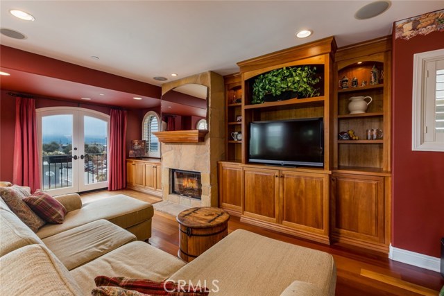 Up the stairs to the top floor is the living level; gorgeous day and night views of the ocean and Palos Verdes; lots of built ins; French doors with retractable screens...ocean breezes!