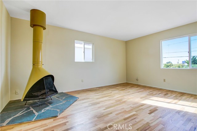 Vintage wood burning fireplace with stone tile work