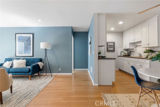 View of the hallway that leads to one of two bedroom suites with attached bath.