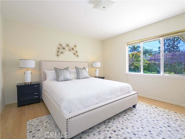 Master bedroom with windows opening to rear yard.