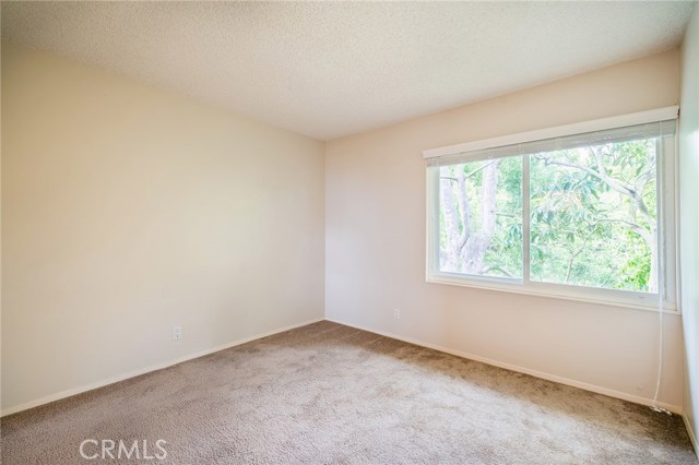 First front bedroom with a walk-in closet and ocean view.