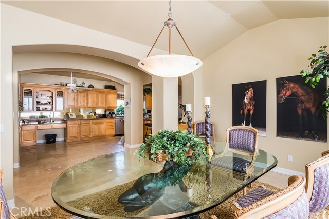 Again, view of dining room looking across central hallway and family style kitchen in background