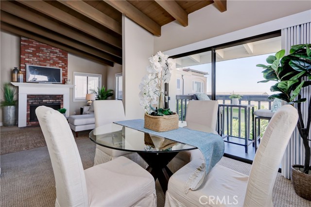 Wonderful view of the fireplace and ocean from your dining table!