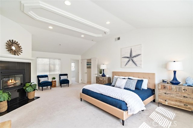 Fireplace and sitting area in primary bedroom