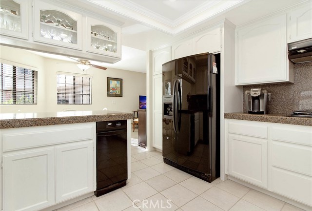 Another view of the kitchen leading to the eating area and family room.