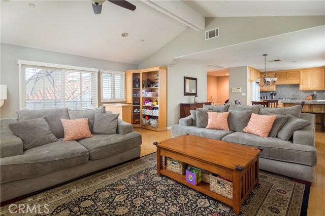 Open living area with vaulted ceilings and custom bar/bookcase Open living area with vaulted ceilings and custom bar/bookcase