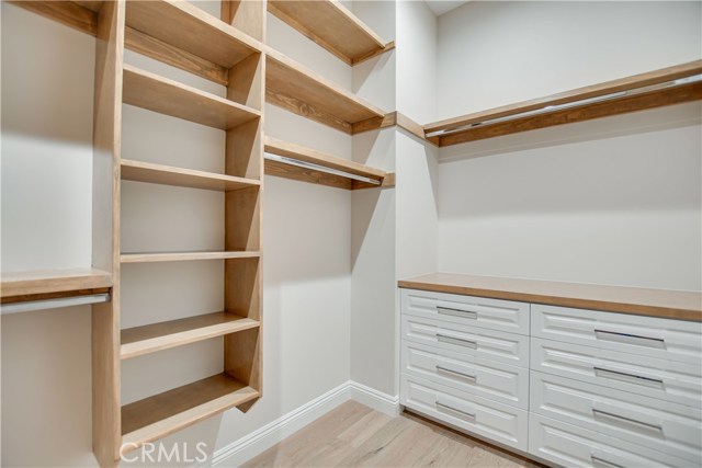 MASTER WALK IN CLOSET W/CUSTOM BUILT INS