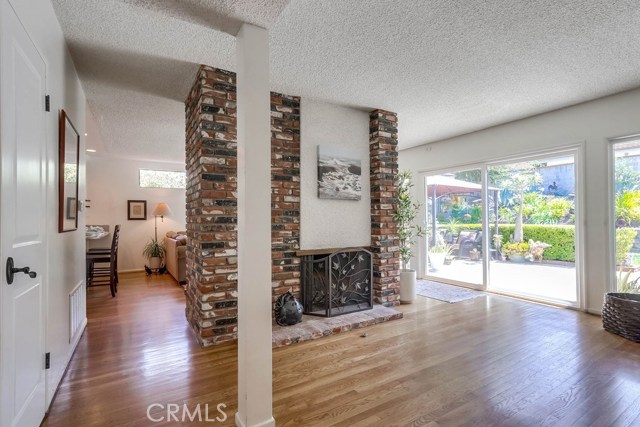 Living room facing towards family room and remodeled eat in kitchen